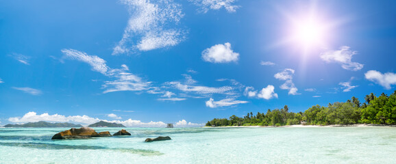 White coral beach sand and azure indian ocean.