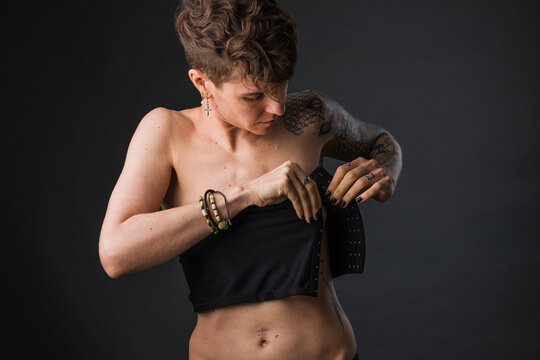 Transgender non-binary tomboy wearing Binder bra for aesthetic. Small breast  Self identity problem Stock Photo