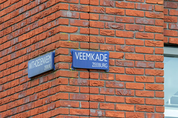 Fototapeta na wymiar Street Sign Veemkade And Withoedenveem At Amsterdam The Netherlands 3 April 2020