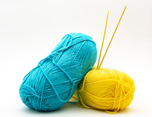 Yarn. Yarn for knitting. The colors of the rainbow. Woolen threads. Knitting needles for knitting in balls of thread.