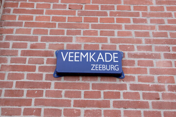 Fototapeta na wymiar Street Sign Veemkade At Amsterdam The Netherlands 2021