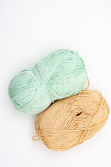 Yarn. Yarn for knitting. The colors of the rainbow. Woolen threads. Knitting needles for knitting in balls of thread.