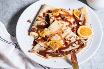 Pancakes on a wooden rustic board
