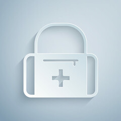 Paper cut First aid kit icon isolated on grey background. Medical box with cross. Medical equipment for emergency. Healthcare concept. Paper art style. Vector