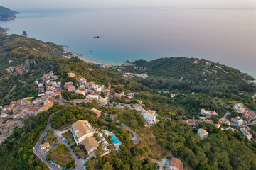 Obraz premium Sunset over coast of Corfu with Pelekas village, Greece.