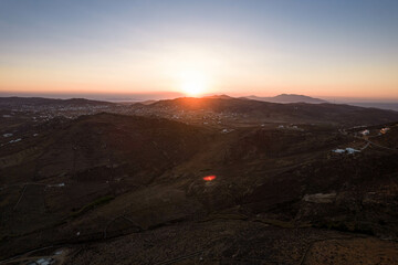 Aerial View of Sun Setting on the Horizon in Mykonos Greece