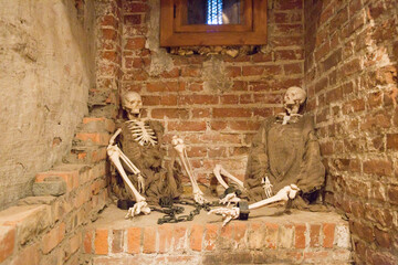 Halloween: Skeletons in rags in the dungeon