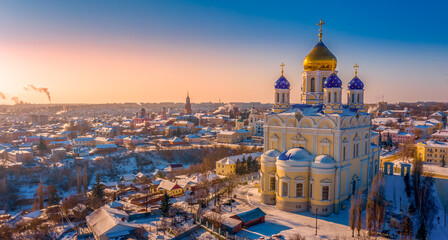 The main cathedral of the city of Yelets, the Ascension Cathedral, rises above the ancient Russian city on a winter evening during sunset