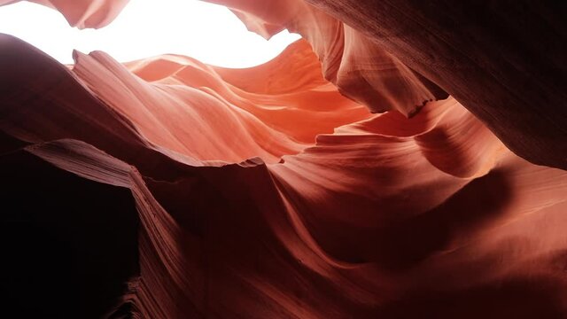 Nature canyon 4K background. Cinematic wavy pattern vibrant red and orange scenic sandstone walls of Antelope Canyon nature park Arizona USA travel. Calm, meditation, relaxation nature concept footage