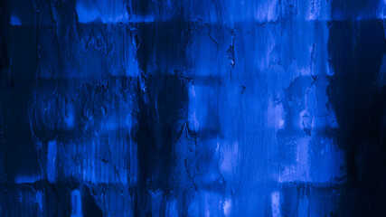 The old brick wall is blue. Dark background, brick texture.

