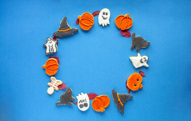 round frame wreath of sweets for the holiday halloween, Trick or Treat candy pumpkin, ghost, skeleton cookies