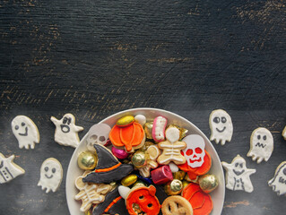 candy bowl of cookies, candy, chocolates and sweets, Halloween Jack o Lantern - Trick or Treat Halloween card dark background