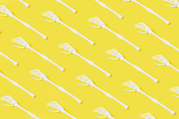 Halloween pattern with skeleton hand. Bizarre and aesthetic concept.