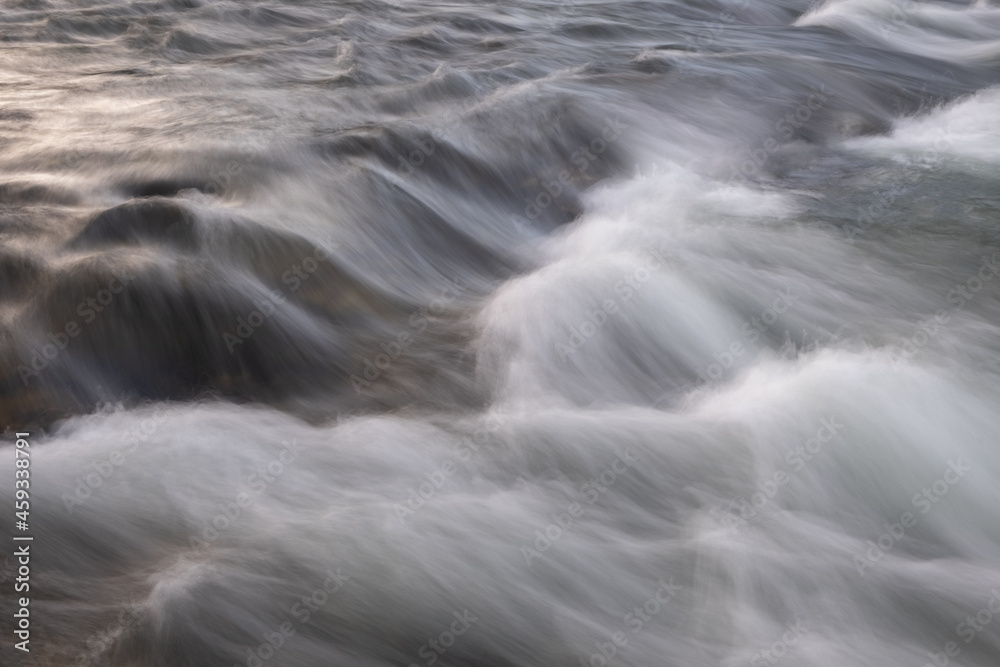 Aufkleber abstract background from long exposure of water stream in a mountain river close-up