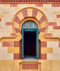 Window decorated with an Arabic-style colored arch