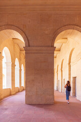 Woman on the interior of Hotel des Invalides in Paris