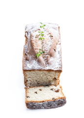 Homemade freshly baked cake loaf with raisins isolated on white background