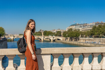 Female tourist in front of Sainte Chapelle in Paris