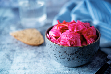 Obraz na płótnie Canvas Fresh raw pickled beet cabbage with casrrot in a bowl