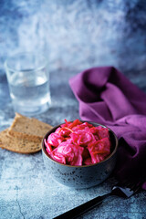 Fresh raw pickled beet cabbage with casrrot in a bowl