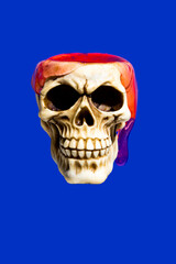Skull with red slime dripping against night blue background. Halloween or Santa Muerte idea.