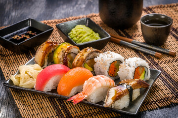Assorted Sushi on Bamboo Mat with Saki