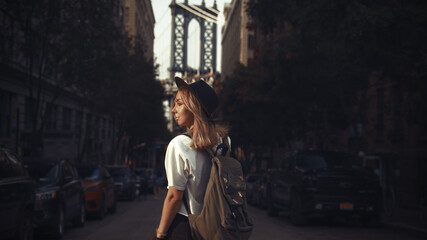 Pretty Woman at The Brooklyn Bridge in New York City at Sunrise