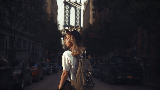 Pretty Woman at The Brooklyn Bridge in New York City at Sunrise
