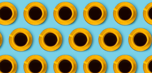 yellow cup of coffee on a colored background
