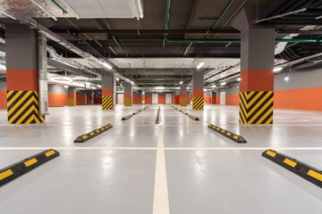 Garage interior, industrial building, empty underground interior in a car parking in a supermarket. 