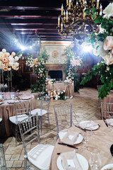decor of fresh flowers in the restaurant for a wedding banquet.