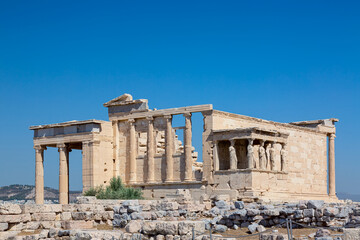 Ancient Erechtheion or Erechtheum temple with Caryatid Porch on the Acropolis, Athens, Greece....