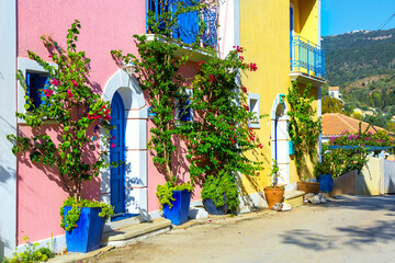 Colorful houses and narrow street of Assos village on Kefalonia island, Greece.