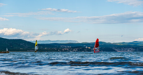 windsurfers in the lagoon against the backdrop of a beautiful sky