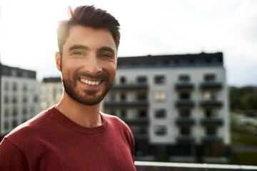 Portrait of young man standing outdoors in the city