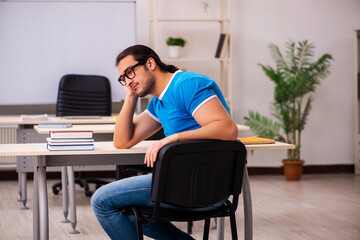 Young male student in the classroom