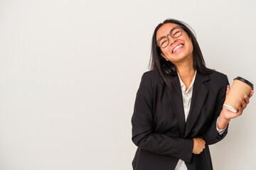 Young business latin woman holding a take away coffee isolated on white background  laughing and having fun.