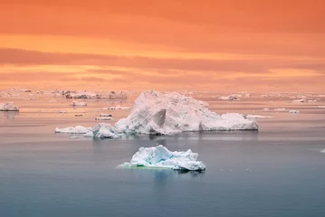 Foto op Aluminium Arctic Icebergs Greenland in the arctic sea. You can easily see that iceberg is over the water surface, and below the water surface. Sometimes unbelievable that 90% of an iceberg is under water  © Furkan TELLIOGLU