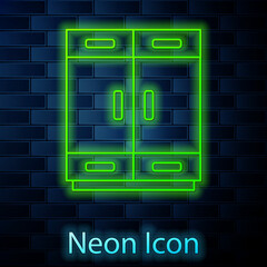 Glowing neon line Wardrobe icon isolated on brick wall background. Vector