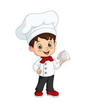 Cute little boy chef holding a silver tray