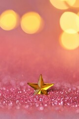 Wallpaper phone shining glitter.New Year and Christmas background. star in pink glitter on shining golden bokeh background.Beautiful festive background in rose gold tones.Shining texture.