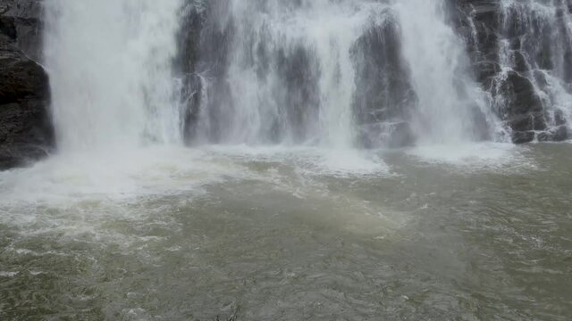  A Close up view of the Abbey Waterfall flowing and joining the Cauvery river in Coorg district of Karnataka, India.