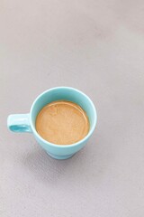 The coffee mug placed on the stone table top
