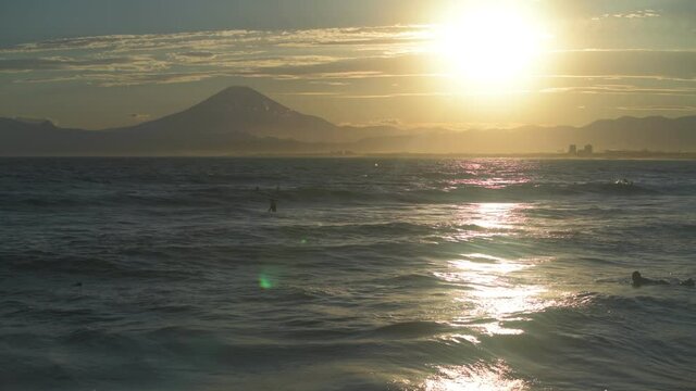 Stock footage of Mount Fuji at sunset from the beach, Enoshima, Japan