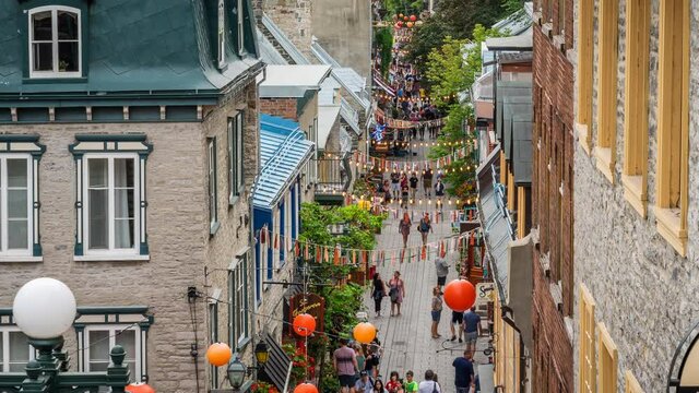 Timelapse view of tourists walking around and shopping at the famous Rue du Petit-Champlain during summer in Old Quebec, Canada. 
