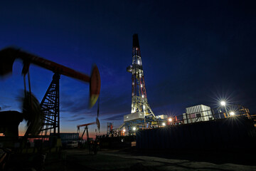 Oil drilling platform in the beautiful night