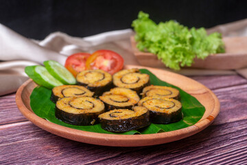 Nori Chicken Nugget, healthy food from vegetables on white plate and wooden table decorated with lettuce, tomato, and cucumber