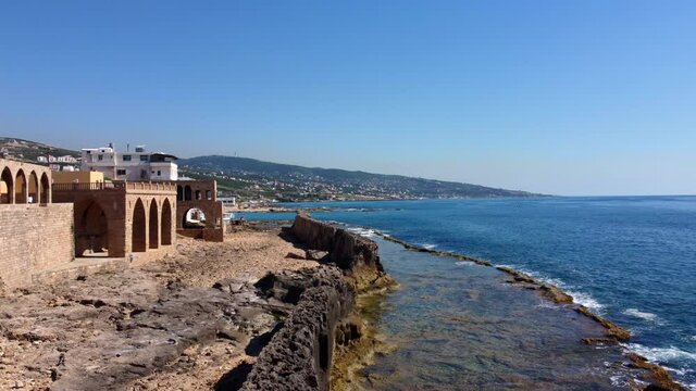 Ancient Phoenician Wall In Batroun, Lebanon - aerial drone shot