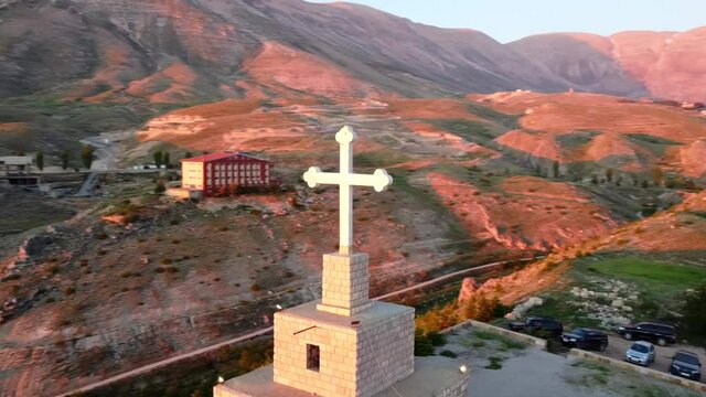 Cedars Cross During Sunset With Scenic Mountain Views In Bsharri, Lebanon. - aerial orbit 