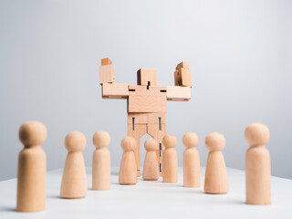 Leadership concept. The Leader or influencer, wooden robot strong power gesture standing among wood human, followers on white background, minimal style.